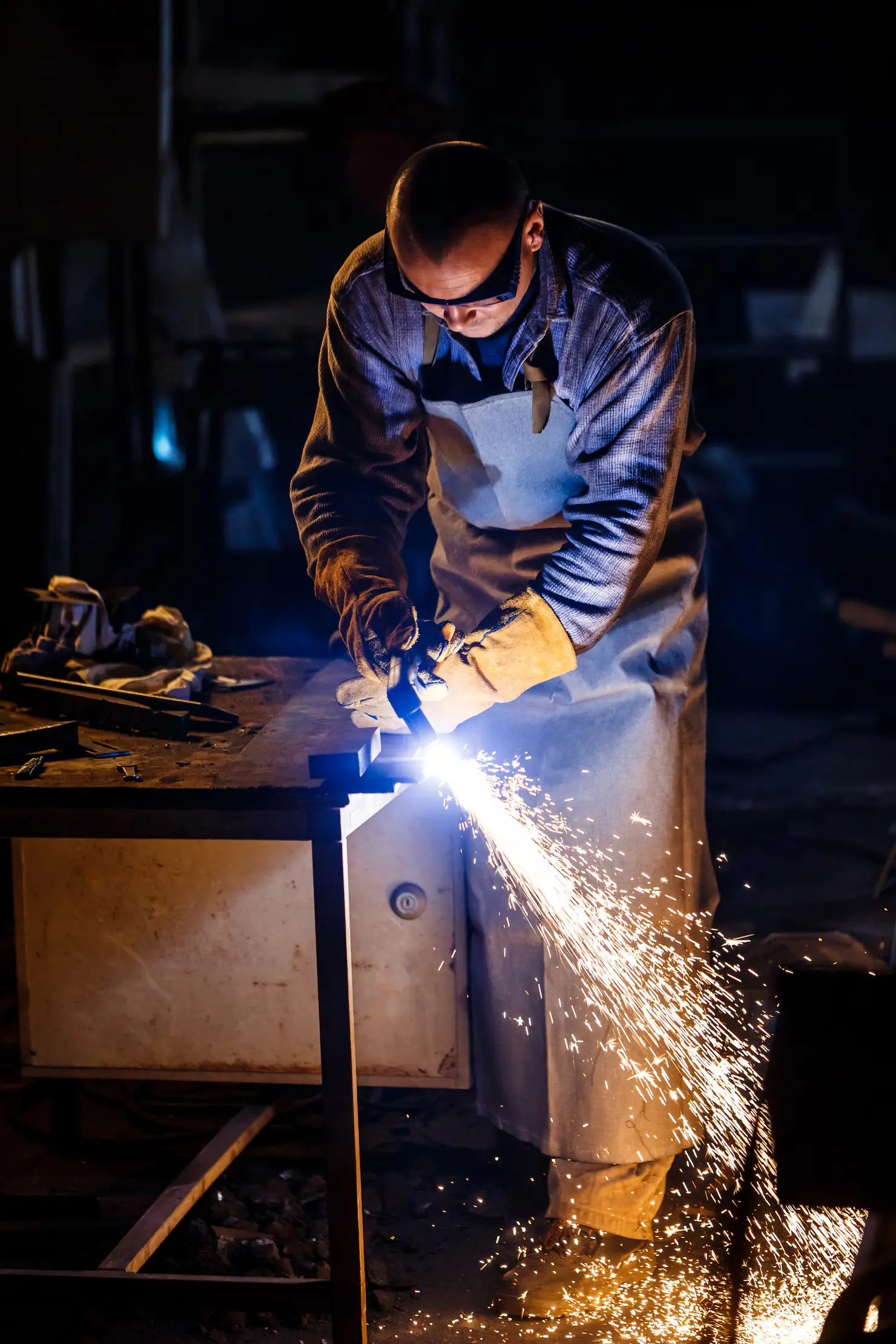 A men worker cutting metal in Melbourne