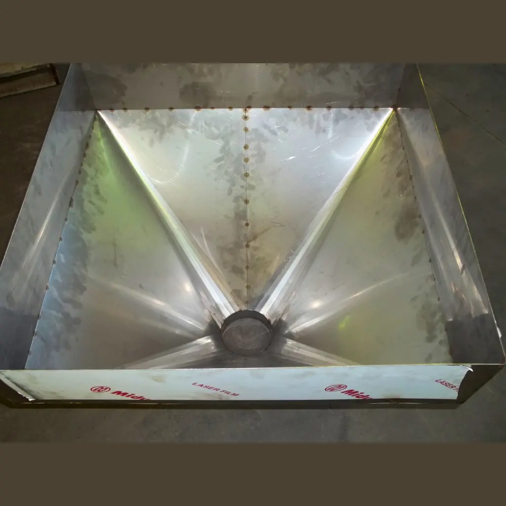 Internal view of stainless steel hopper showing precision folded sheet metal panels and joints