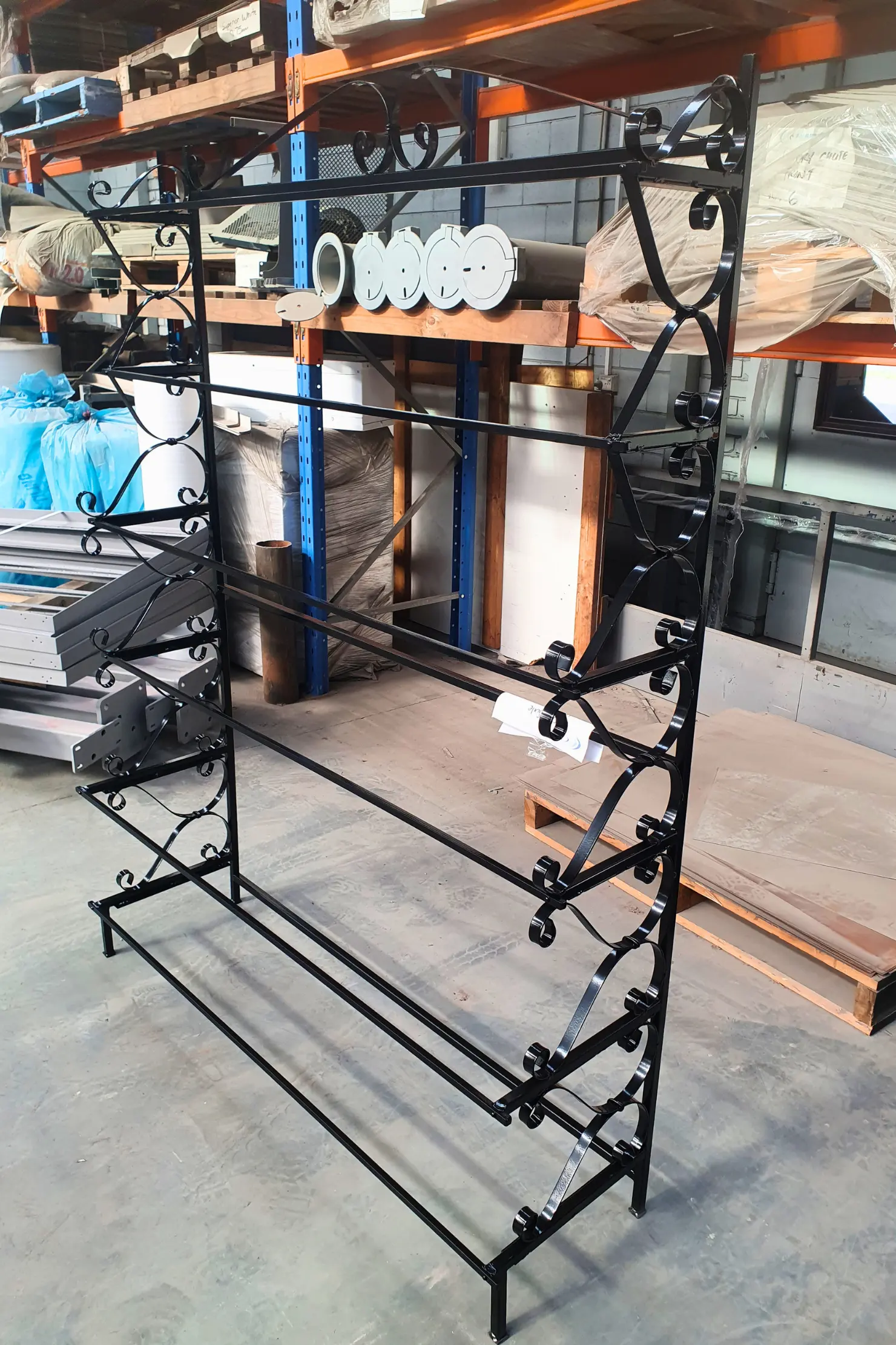 Custom ornamental metal rack with smooth polished and coated finish in Melbourne workshop